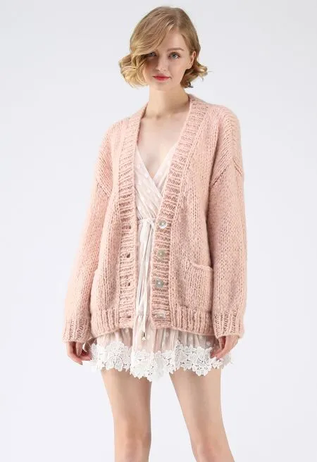Gilet ample rose clair en maille épaisse avec boutons